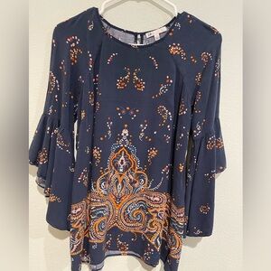 DR2 women’s navy with Moroccan inspired print. Bell sleeves keyhole clos…